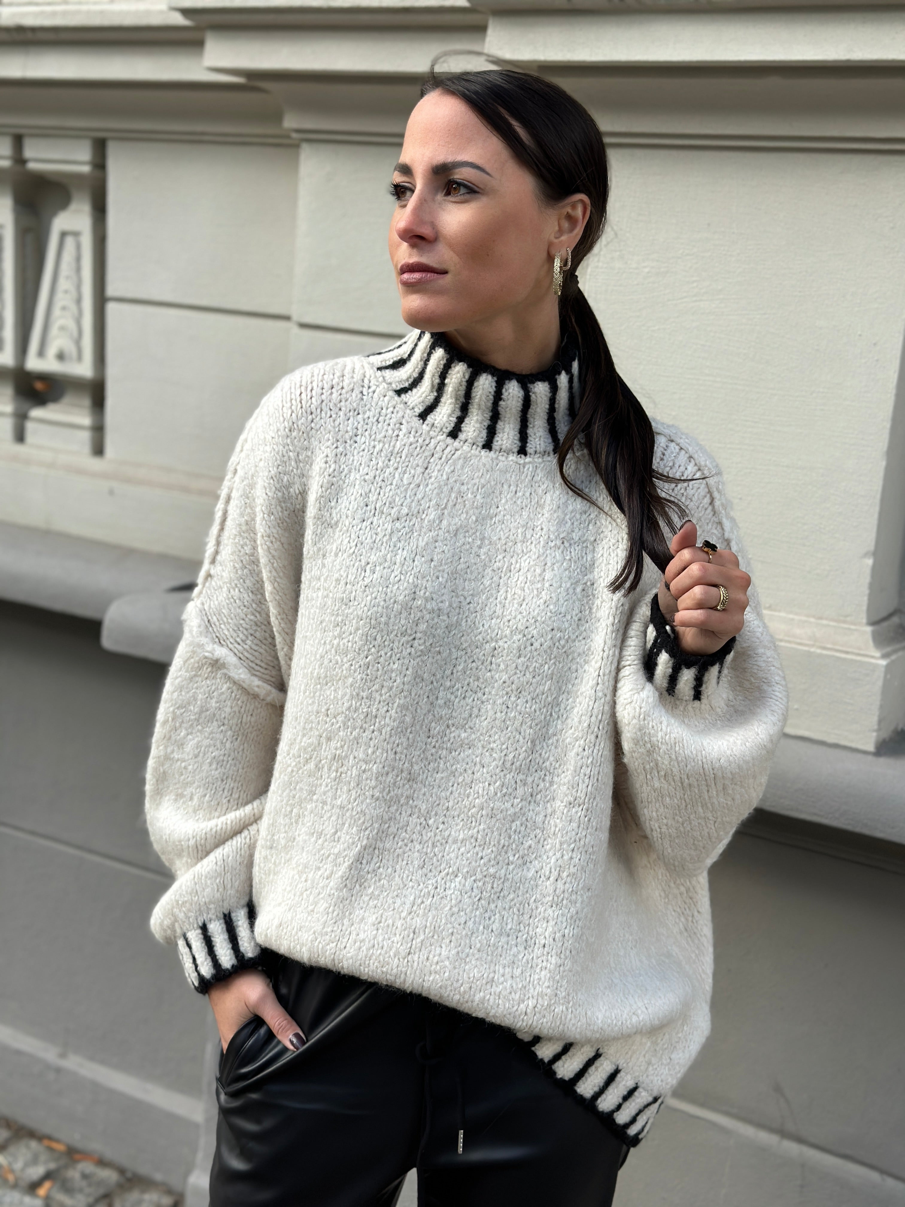 knitted sweater with eye-catching stand-up collar