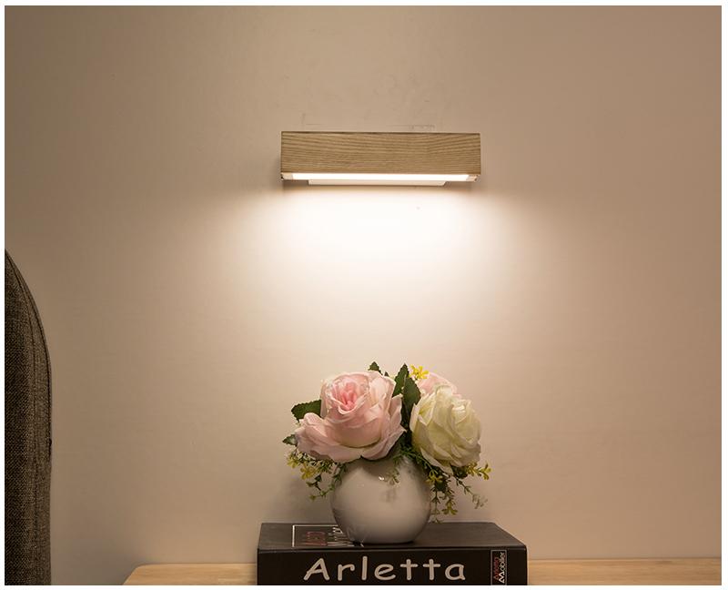 Rotatable LED wall lamp made of wood